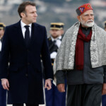 French President Emmanuel Macron and Indian Prime Minister Narendra Modi attend a departure ceremony at Marseille Provence airport in Marignane as part of a visit in Marseille, France, February 12, 2025. REUTERS/Christian Hartmann/Pool