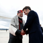 French President Emmanuel Macron shakes hands with Indian Prime Minister Narendra Modi after a departure ceremony at Marseille Provence airport in Marignane as part of a visit in Marseille, France, February 12, 2025.  REUTERS/Christian Hartmann/Pool narendra modi france