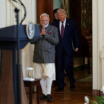 U.S. President Donald Trump and Indian Prime Minister Narendra Modi arrive for a joint press conference at the White House in Washington, D.C., U.S., February 13, 2025. REUTERS/Nathan Howard