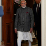 U.S. President Donald Trump and Indian Prime Minister Narendra Modi arrive for a joint press conference at the White House in Washington, D.C., U.S., February 13, 2025. REUTERS/Nathan Howard