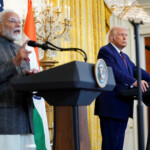 U.S. President Donald Trump listens as Indian Prime Minister Narendra Modi speaks during a joint press conference at the White House in Washington, D.C., U.S., February 13, 2025. REUTERS/Nathan Howard