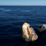The Crew Dragon capsule containing Butch Wilmore and Suni Williams and two other astronauts floats after their splashdown following their return to earth from the International Space Station off the coast of Florida, U.S. March 18, 2025 in a still image from video. NASA TV/Handout via REUTERS.