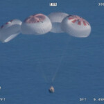 Butch Wilmore and Suni Williams and two other astronauts descend by parachute in the Crew Dragon spacecraft to their splashdown, following their return to earth from the International Space Station off the coast of Florida, U.S. March 18, 2025 in a still image from video. NASA TV/Handout via REUTERS.
