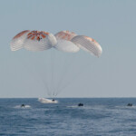 Support teams work around a SpaceX Dragon spacecraft shortly after it landed with NASA astronauts Nick Hague, Suni Williams, Butch Wilmore, and Roscosmos cosmonaut Aleksandr Gorbunov aboard in the water off the coast of Tallahassee, Florida, Tuesday, March 18, 2025. NASA/Keegan Barber Handout via REUTERS