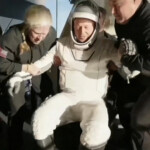 Butch Wilmore is helped to leave a Crew Dragon space capsule after he and Suni Williams, and two other astronauts, splashed down following their return to earth from the International Space Station off the coast of Florida, U.S. March 18, 2025 in a still image from video. NASA TV/Handout via REUTERS