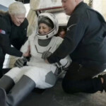 Suni Williams is helped to leave a Crew Dragon space capsule after she and Butch Wilmore, and two other astronauts, splashed down following their return to earth from the International Space Station off the coast of Florida, U.S. March 18, 2025 in a still image from video. NASA TV/Handout via REUTERS