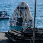 Support teams work around a SpaceX Dragon spacecraft shortly after it landed with NASA astronauts Nick Hague, Suni Williams, Butch Wilmore, and Roscosmos cosmonaut Aleksandr Gorbunov aboard in the water off the coast of Tallahassee, Florida, Tuesday, March 18, 2025. NASA/Keegan Barber/ Handout via REUTERS