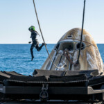 Support teams work around a SpaceX Dragon spacecraft shortly after it landed with NASA astronauts Nick Hague, Suni Williams, Butch Wilmore, and Roscosmos cosmonaut Aleksandr Gorbunov aboard in the water off the coast of Tallahassee, Florida, Tuesday, March 18, 2025. NASA/Keegan Barber/ Handout via REUTERS