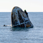 Support teams work around a SpaceX Dragon spacecraft shortly after it landed with NASA astronauts Nick Hague, Suni Williams, Butch Wilmore, and Roscosmos cosmonaut Aleksandr Gorbunov aboard in the water off the coast of Tallahassee, Florida, Tuesday, March 18, 2025. NASA/Keegan Barber/ Handout via REUTERS