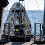 Support teams onboard the SpaceX recovery ship MEGAN work around a SpaceX Dragon spacecraft shortly after it landed with NASA astronauts Nick Hague, Suni Williams, Butch Wilmore, and Roscosmos cosmonaut Aleksandr Gorbunov aboard in the water off the coast of Tallahassee, Florida, Tuesday, March 18, 2025. NASA/Keegan Barber/ Handout via REUTERS