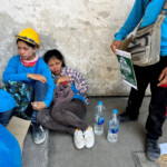 Workers sit on the ground near a site of a collapsed building after the tremors of a strong earthquake that struck central Myanmar on Friday affected Bangkok, Thailand, March 28, 2025. REUTERS/Ann Wang