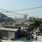 Cars are seen on a road near near a building that collapsed after a strong earthquake struck central Myanmar on Friday, earthquake monitoring services said, which affected Bangkok as well with people pouring out of buildings in the Thai capital in panic after the tremors, in Bangkok, Thailand, March 28, 2025. REUTERS/Athit Perawongmetha