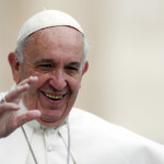 FILE PHOTO: Pope Francis waves as he arrives to lead the weekly audience in Saint Peter's Square at the Vatican, October 21, 2015. REUTERS/Alessandro Bianchi/File Photo