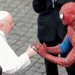 FILE PHOTO: Pope Francis greets a person dressed as Spider-Man after the general audience, amid the coronavirus disease (COVID-19) pandemic, at the Vatican, June 23, 2021. REUTERS/Remo Casilli/File Photo