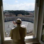 FILE PHOTO: Pope Francis sends a virtual hug after delivering his weekly Angelus prayer via video at the Vatican, March 15, 2020. Vatican Media/ Handout via REUTERS/File Photo ATTENTION EDITORS - THIS IMAGE WAS PROVIDED BY A THIRD PARTY.