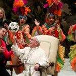 FILE PHOTO: Pope Francis plays with a ball as members of Circus of Cuba perform during the Wednesday general audience in Paul VI Hall at the Vatican January 2, 2019. REUTERS/Tony Gentile/File Photo