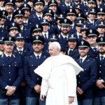 FILE PHOTO: Pope Francis poses with Italian police officers during the weekly general audience at the Vatican, November 27, 2019. REUTERS/Guglielmo Mangiapane/File Photo
