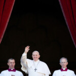 FILE PHOTO: Pope Francis waves as he delivers the "Urbi et Orbi" Christmas Day message from the main balcony of St. Peter's Basilica at the Vatican, December 25, 2019. REUTERS/Yara Nardi/File Photo