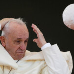 FILE PHOTO: A gust of wind blows Pope Francis's skull cap off during his pastoral visit in Alessano, southern Italy, April 20, 2018. REUTERS/Max Rossi/File Photo