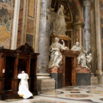 FILE PHOTO: Pope Francis kneels before a priest to confess during a penitential liturgy in St. Peter's Basilica at the Vatican, March 29, 2019. Andrew Medichini/Pool via REUTERS/File Photo