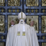 FILE PHOTO: Pope Francis opens the Holy Door to mark the opening of the Catholic Holy Year, or Jubilee, in St. Peter's Basilica, at the Vatican, December 8, 2015. REUTERS/Max Rossi/File Photo