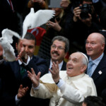 FILE PHOTO: Pope Francis releases a white dove prior to delivering a Holy Mass at the Catholic Cathedral of the Holy Spirit in Istanbul November 29, 2014. REUTERS/Stoyan Nenov/File Photo Pope Francis