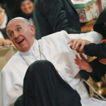 FILE PHOTO: Pope Francis reacts as he is greeted by cloistered nuns at the Duomo during his pastoral visit in Naples March 21, 2015 REUTERS/Stefano Rellandini/File Photo