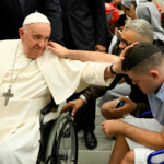 FILE PHOTO: Pope Francis blesses a faithful during the weekly general audience in Paul VI hall at the Vatican, August 9, 2023. Vatican Media/Handout via REUTERS/File Photo ATTENTION EDITORS - THIS IMAGE WAS PROVIDED BY A THIRD PARTY.