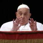 FILE PHOTO: Pope Francis gestures from a balcony, on the day the "Urbi et Orbi" (to the city and to the world) message is delivered at St. Peter's Square, on Easter Sunday, at the Vatican, April 20, 2025. REUTERS/Guglielmo Mangiapane/File Photo