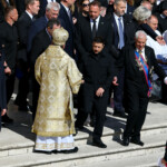Ukraine's President Volodymyr Zelenskiy stands on the day of the funeral Mass of Pope Francis, at the Vatican, April 26, 2025. REUTERS/Kai Pfaffenbach
