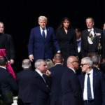 U.S President Donald Trump and first lady Melania Trump arrive ahead of the funeral Mass of Pope Francis in St. Peter's Square at the Vatican, April 26, 2025. REUTERS/Guglielmo Mangiapane