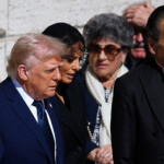 U.S President Donald Trump and first lady Melania Trump walk to attend the funeral Mass of Pope Francis, at the Vatican, April 26, 2025. REUTERS/Kai Pfaffenbach