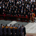 The coffin of Pope Francis is carried during the funeral Mass of Pope Francis in St. Peter's Square at the Vatican, April 26, 2025. REUTERS/Kai Pfaffenbach