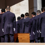 Pallbearers stand next to the coffin of Pope Francis, during his funeral mass, at the Vatican, April 26, 2025. REUTERS/Yara Nardi