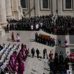 The coffin of Pope Francis is carried during the funeral Mass of Pope Francis in St. Peter's Square at the Vatican, April 26, 2025. REUTERS/Nathan Howard