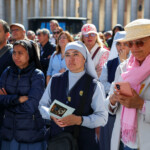 Faithful attend the funeral Mass of Pope Francis in St. Peter's Square, at the Vatican, April 26, 2025. REUTERS/Kevin Coombs