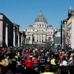 People gather on the day of the funeral for Pope Francis, in Rome, Italy, April 26, 2025. REUTERS/Benoit Tessier
