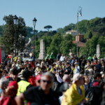 People gather on the day of the funeral for Pope Francis, in Rome, Italy, April 26, 2025. REUTERS/Benoit Tessier