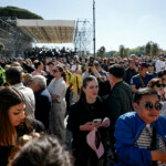 People gather on the day of the funeral for Pope Francis, in Rome, Italy, April 26, 2025. REUTERS/Benoit Tessier