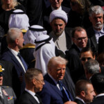 U.S President Donald Trump and Former U.S. President Joe Biden attend the funeral Mass of Pope Francis in St. Peter's Square at the Vatican, April 26, 2025. REUTERS/Nathan Howard