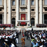 Faithful attend the funeral Mass of Pope Francis in St. Peter's Square at the Vatican, April 26, 2025. REUTERS/Guglielmo Mangiapane