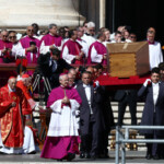 Pallbearers carry the coffin of Pope Francis during his funeral Mass in St. Peter's Square at the Vatican, April 26, 2025. REUTERS/Guglielmo Mangiapane