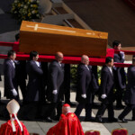The coffin of Pope Francis is carried during the funeral Mass of Pope Francis in St. Peter's Square at the Vatican, April 26, 2025. REUTERS/Nathan Howard