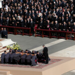 Pallbearers place the coffin of Pope Francis, during his funeral Mass, in St. Peter's Square, at the Vatican, April 26, 2025. REUTERS/Remo Casilli