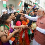 Members of Indian community in Thailand extend a warm welcome to PM Modi upon his arrival