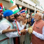 Members of Indian community in Thailand extend a warm welcome to PM Modi upon his arrival