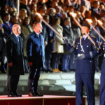 Outgoing German Chancellor Olaf Scholz stands next to Defence Minister Boris Pistorius during the military ceremonial Grand Tattoo ("Grosser Zapfenstreich") of the German "Bundeswehr", the armed forces, in his honour, at the Defence Ministry in Berlin, Germany May 5, 2025. REUTERS/Nadja Wohlleben
