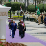 U.S. President Donald Trump and Saudi Crown Prince Mohammed Bin Salman walk as they meet in Riyadh, Saudi Arabia, May 13, 2025. REUTERS/Brian Snyder