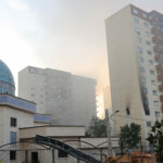Smoke rises as a building stands damaged in the aftermath of Israeli strikes, in Tehran, Iran, June 13, 2025. Majid Asgaripour/WANA (West Asia News Agency) via REUTERS