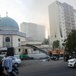 Smoke rises as a building stands damaged in the aftermath of Israeli strikes, in Tehran, Iran, June 13, 2025. Majid Asgaripour/WANA (West Asia News Agency) via REUTERS